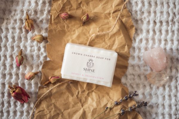 Crown Chakra Soap, wrapped on crumpled brown paper with scattered rose buds, lavender petals and rose quartz | Shine Body & Bath